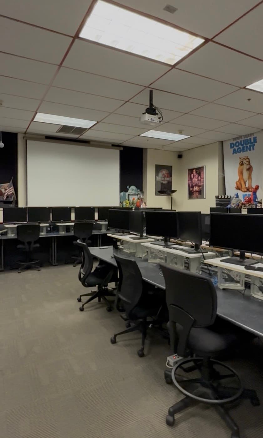 The Digital Media Institute lab with projection screen and workstations